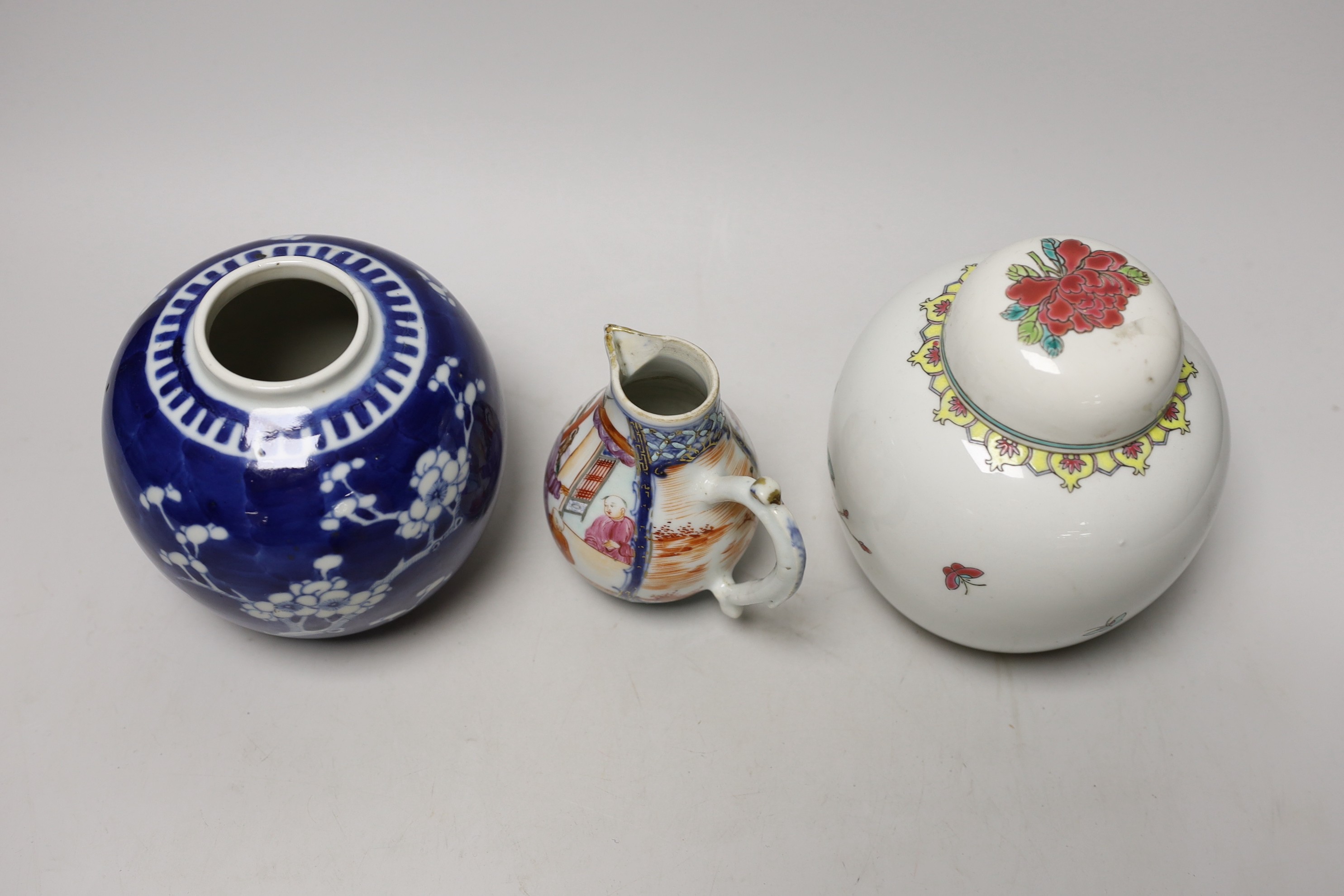 A Chinese famille rose Mandarin sparrow beak jug, Qianlong period, 10.5cm high and two 20th Centry porcelain jars